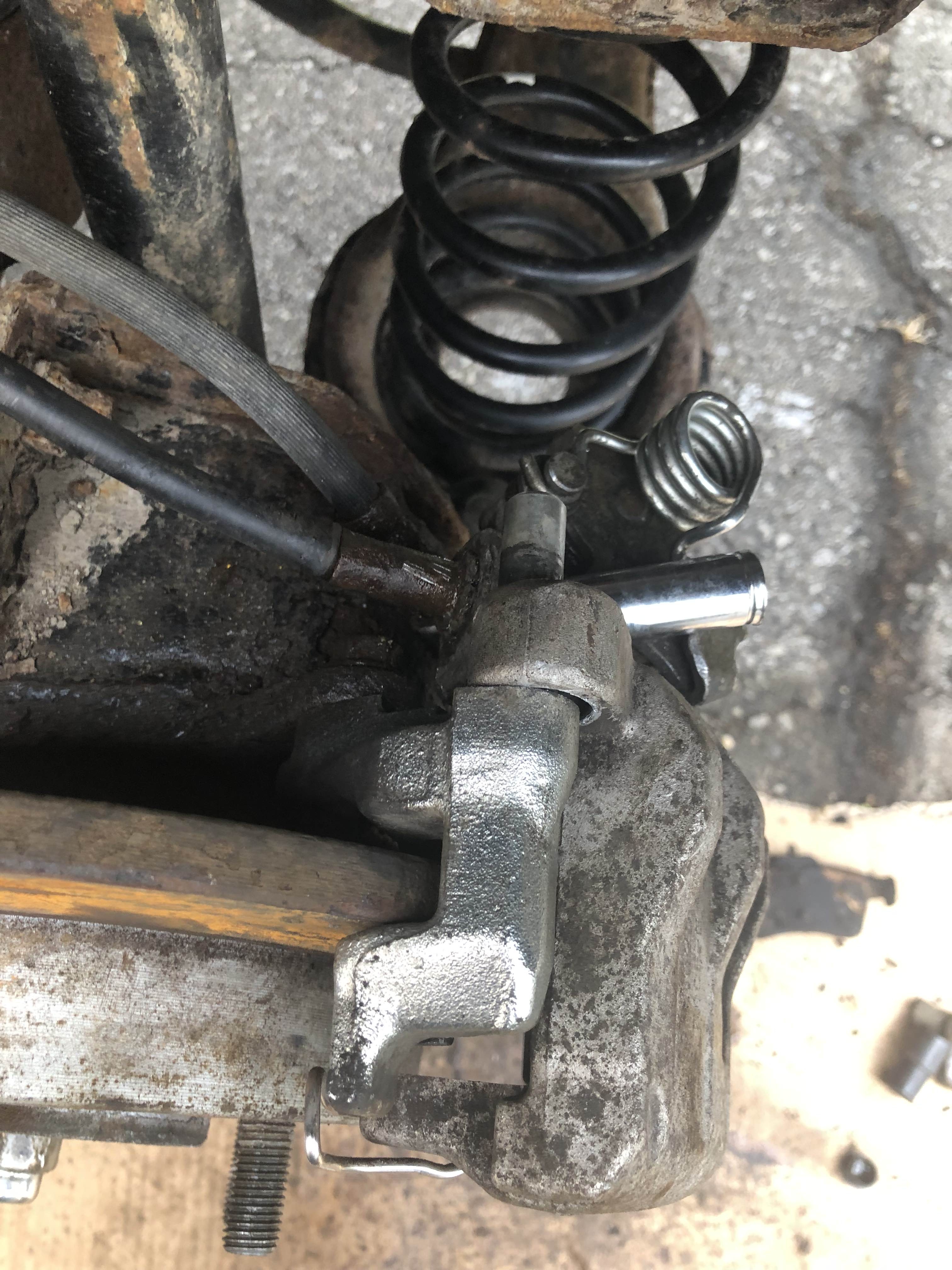 11mm socket being used as a punch for ebrake cable
