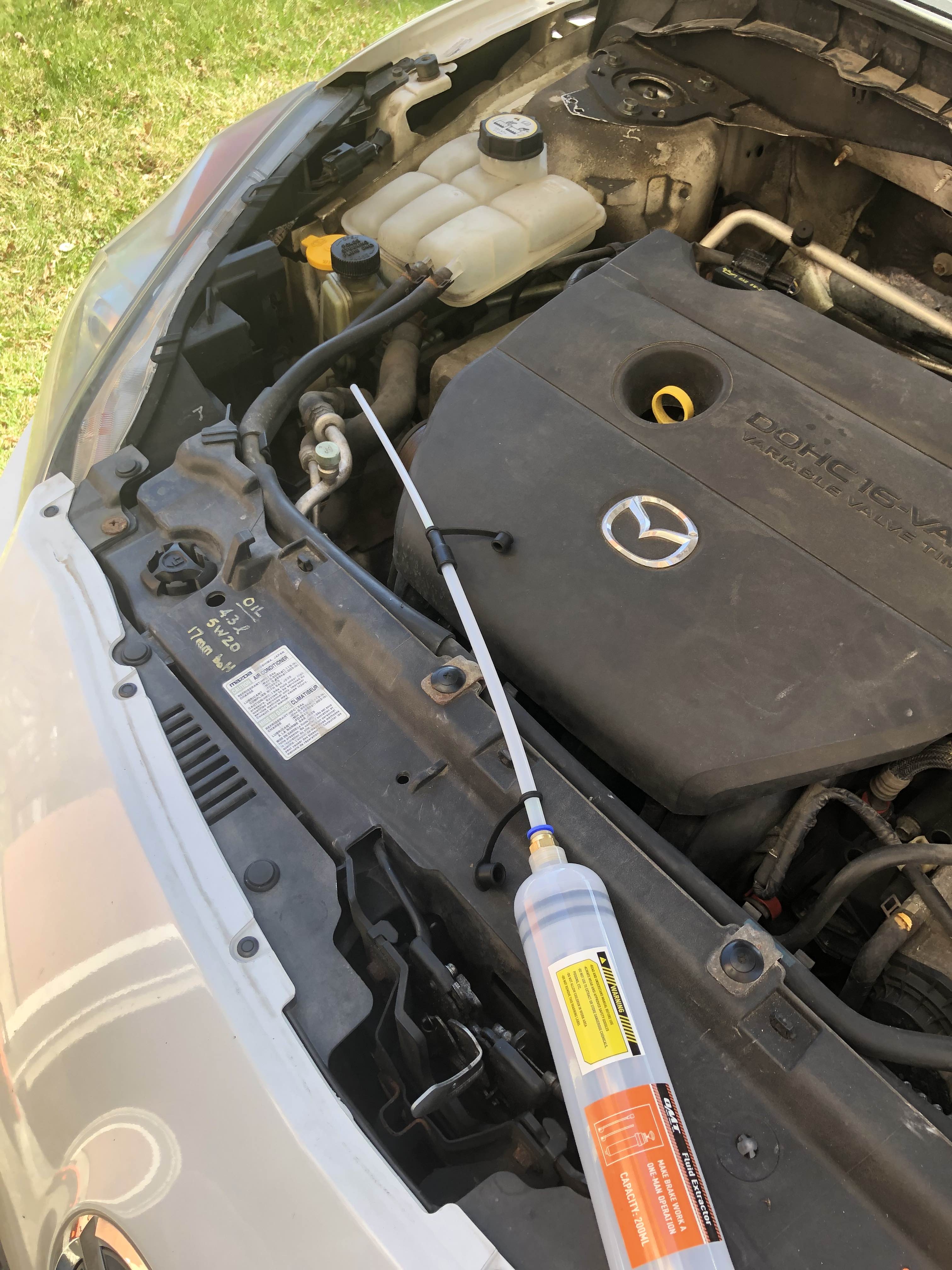 Long syringe in engine bay