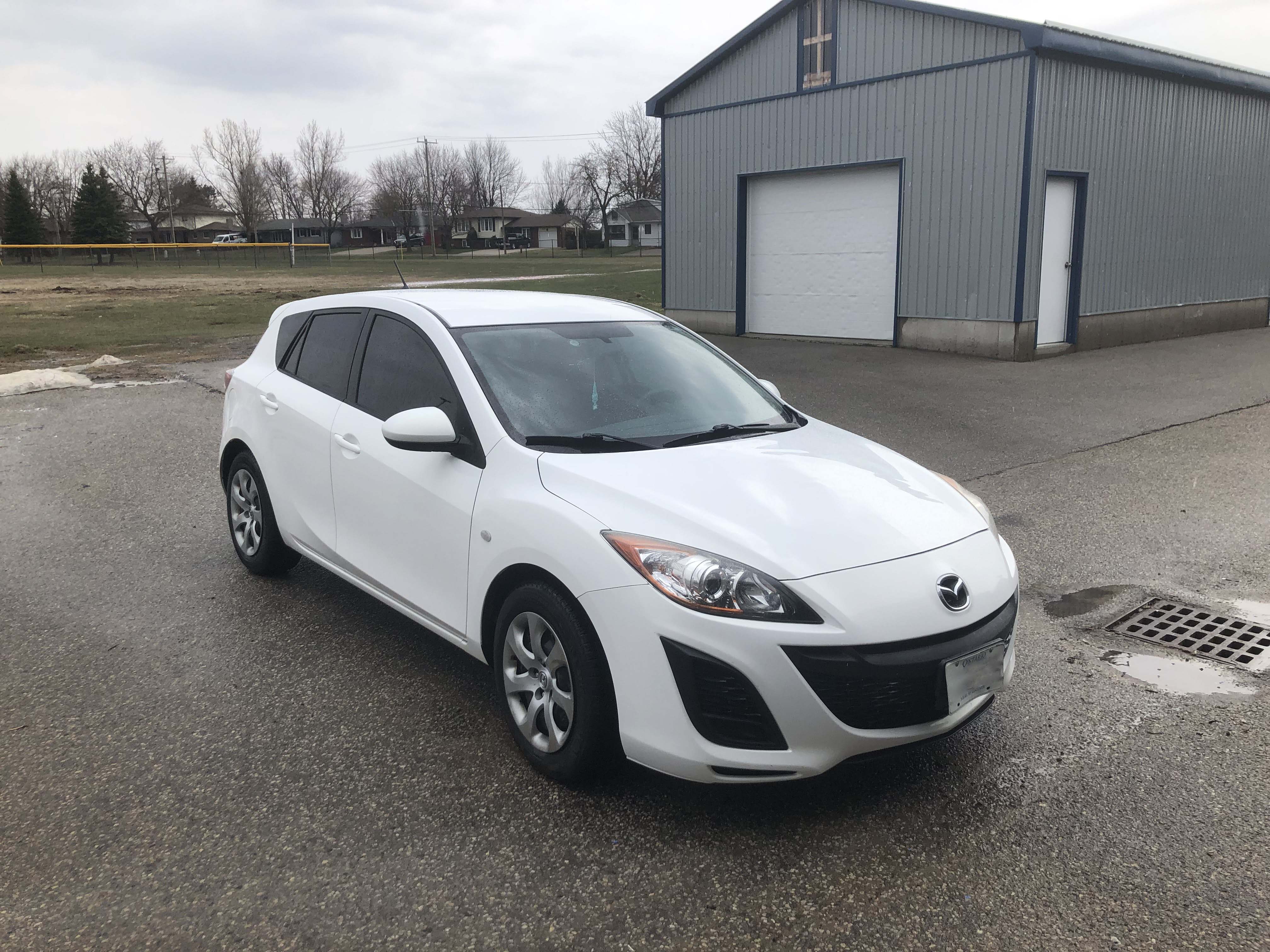 Picture of a white 2010 Mazda 3 Hatchback