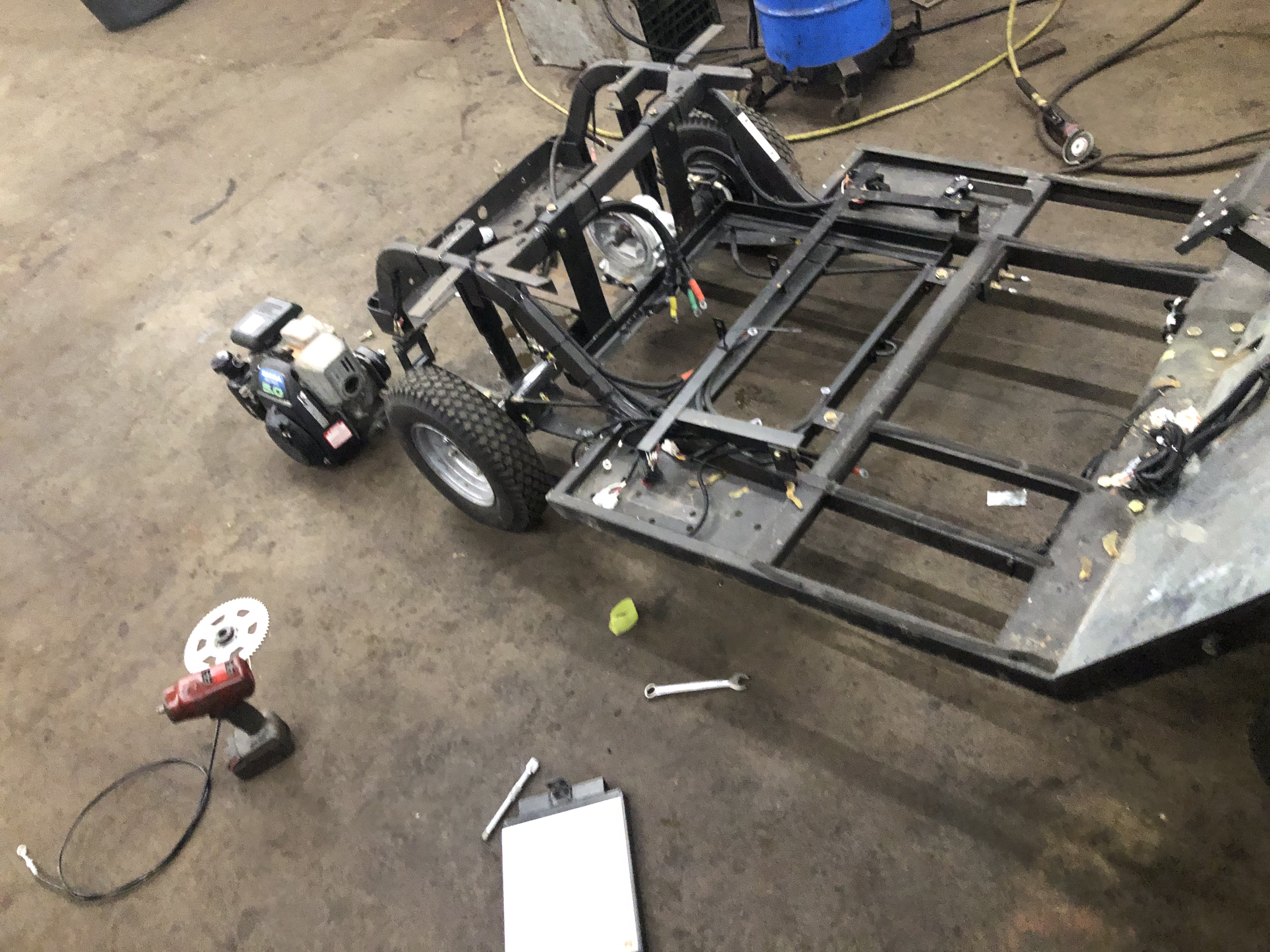 Cart frame in garage with tools around