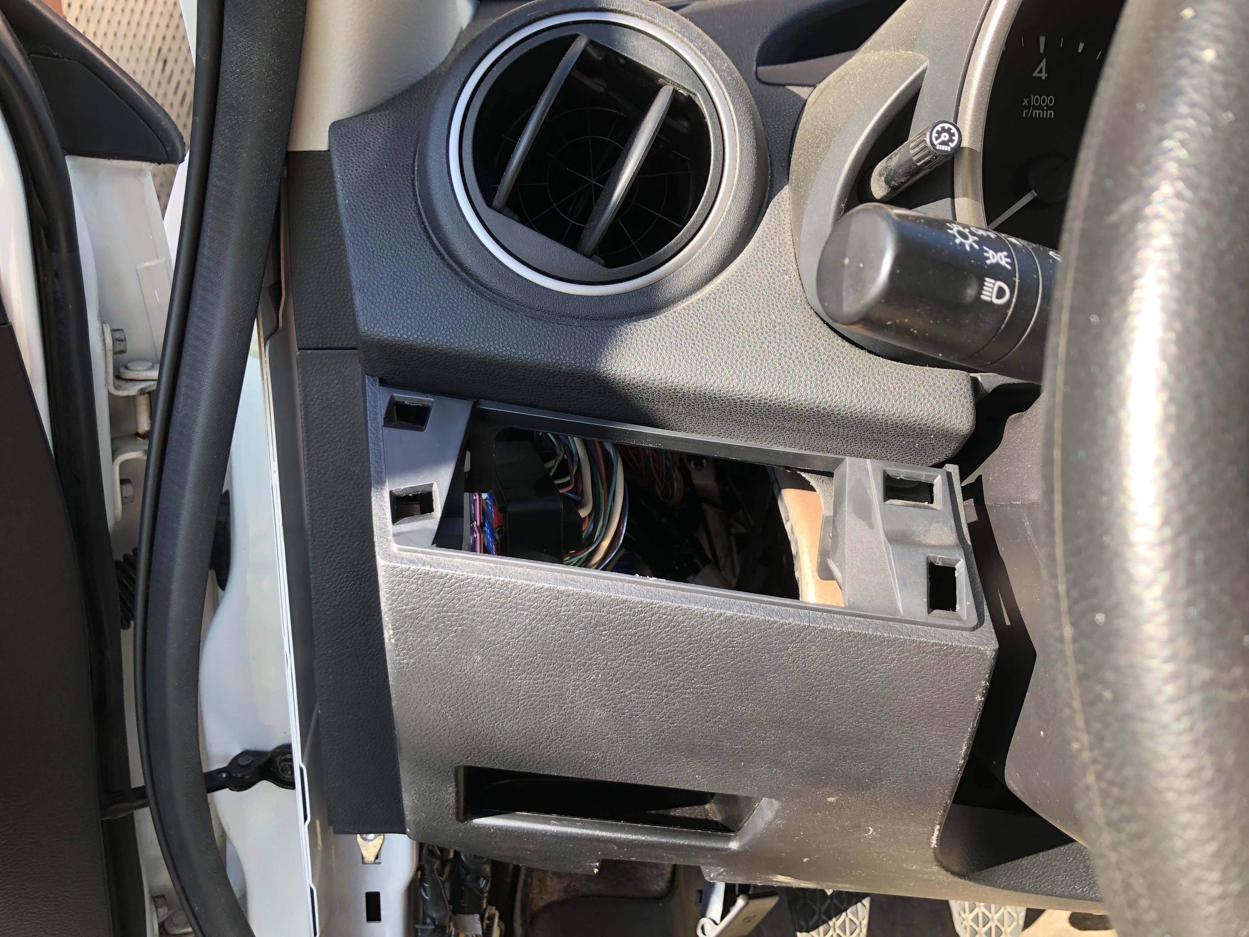 Car trim panel with a rectangular hole in it