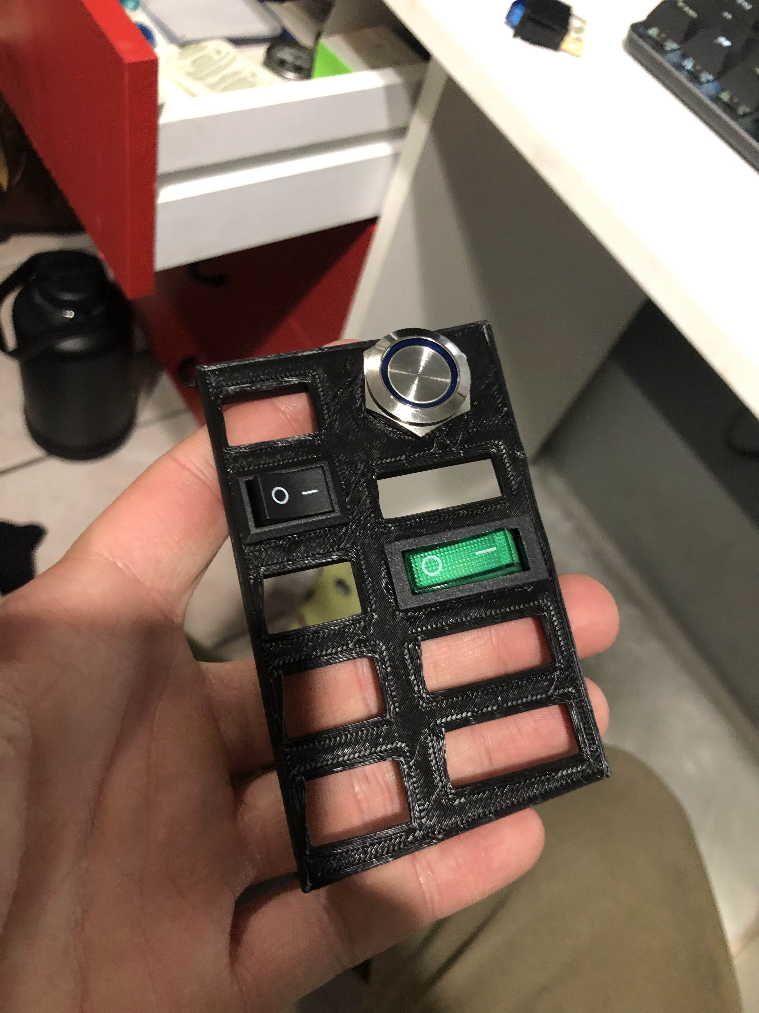 3D print of the model with switches and a button in place