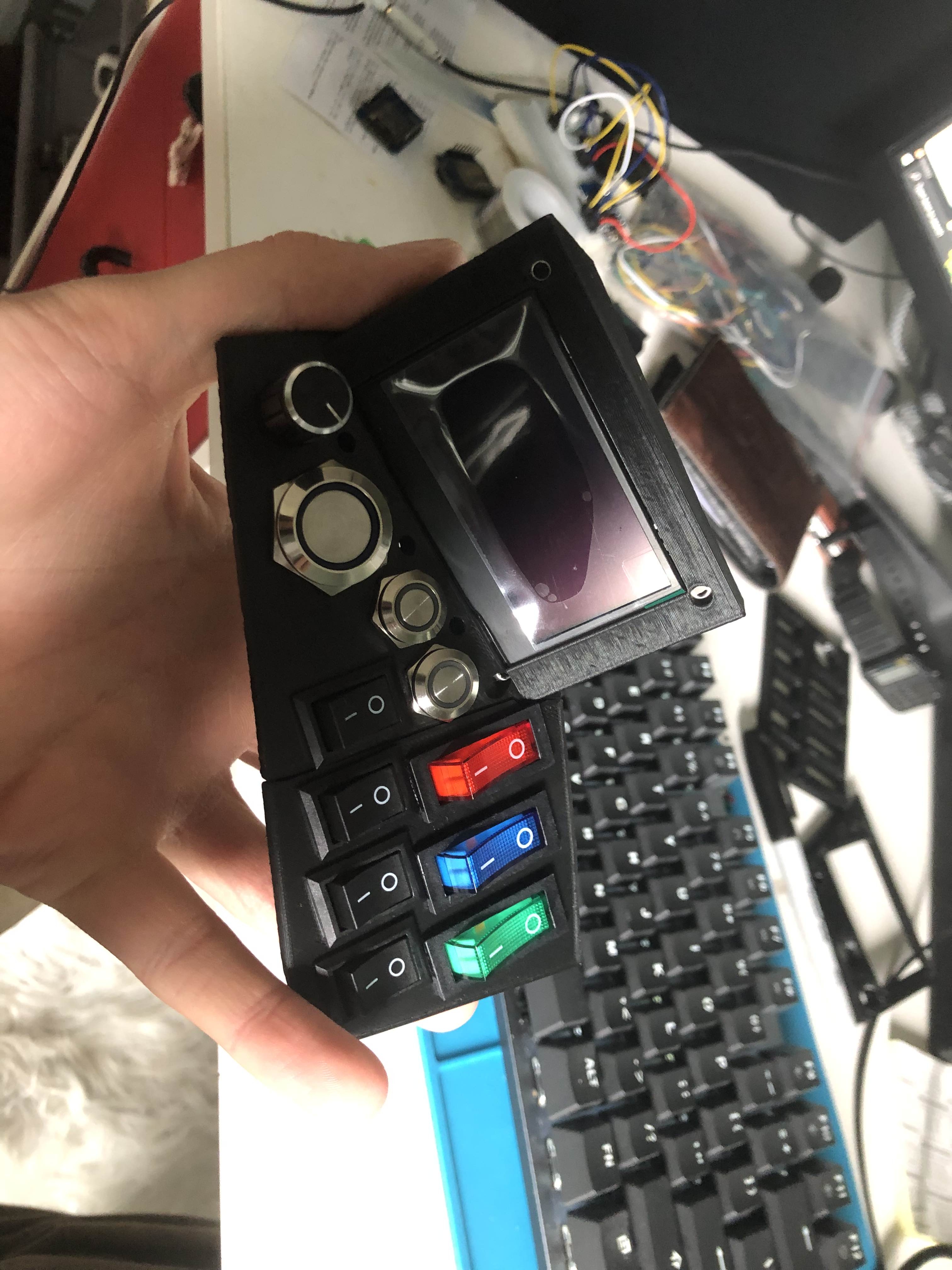 3D print of the model with switches and a button in place