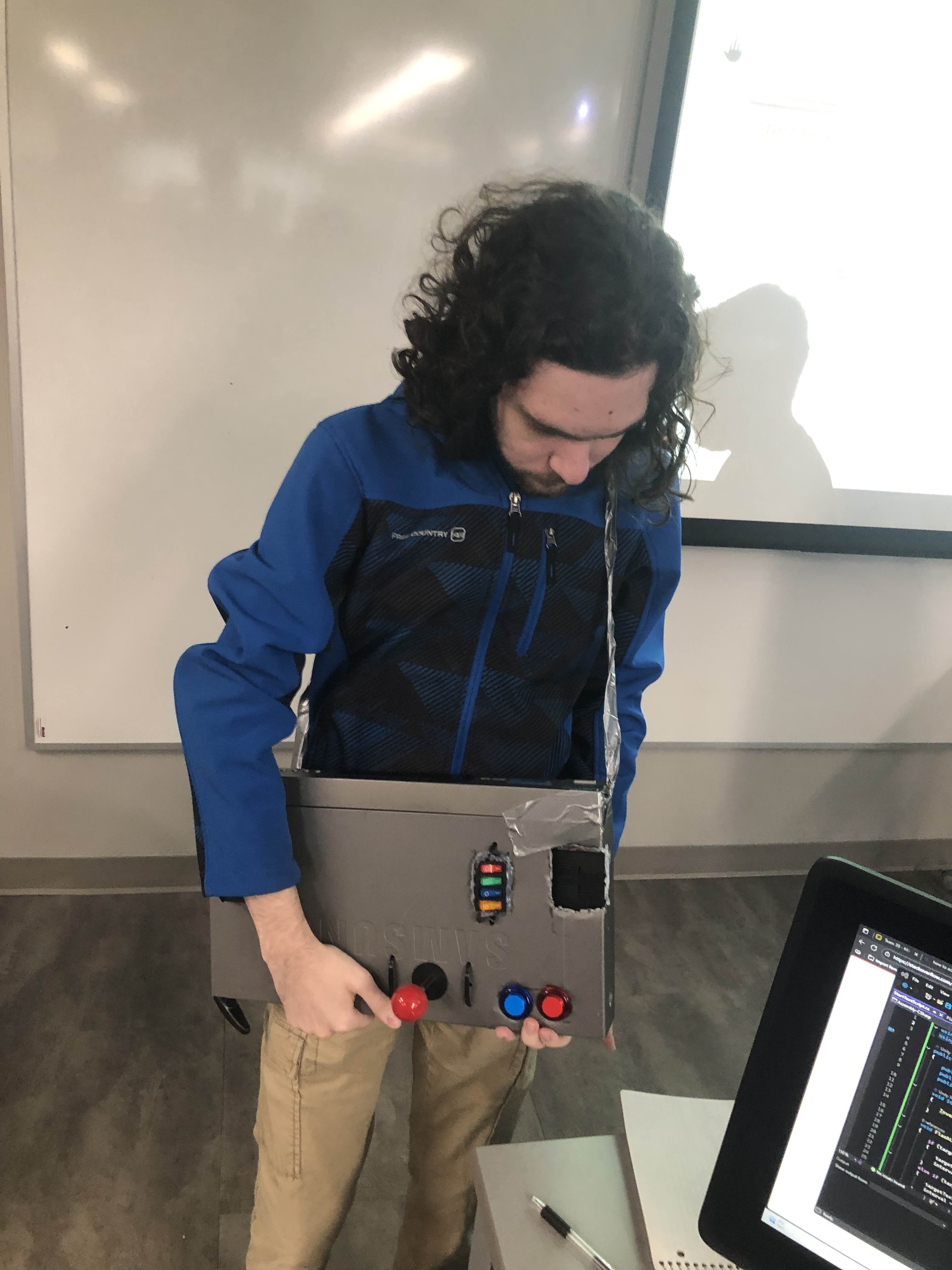 Person holding early version of instrument